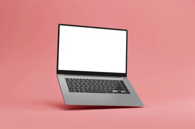 Pembe arka planda bir laptop. 3d oluşturma