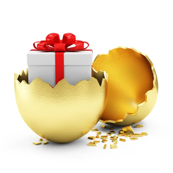 Золотое яйцо с коробкой подарков внутри — стоковое фото