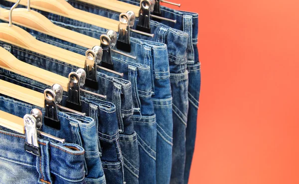 Row of hanged blue jeans — Stock Photo, Image