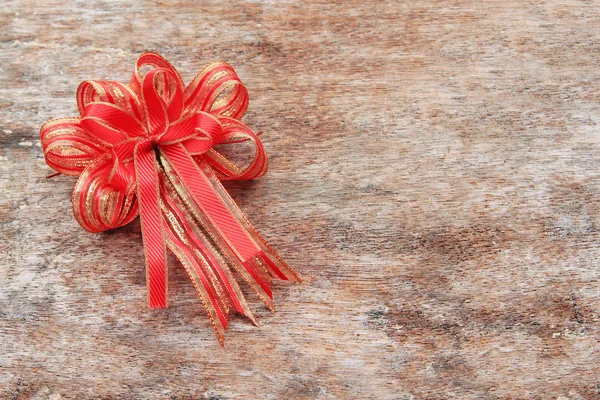 Red Ribbon on Old Wood Background — Stock Photo, Image