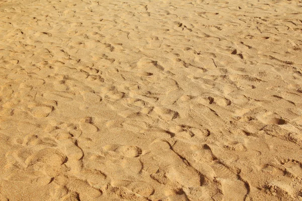 Sea sand with footprints — Stock Photo, Image