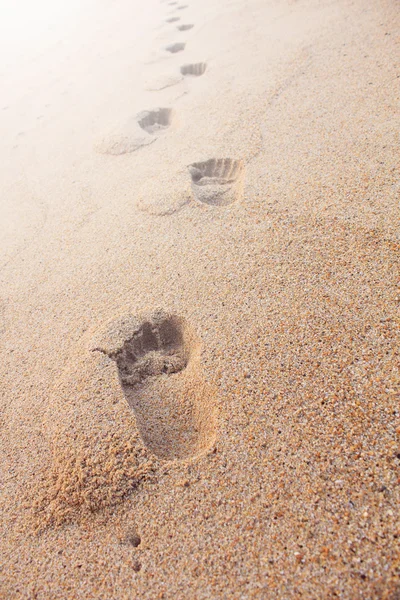 Footprints on the sand beach — Stock Photo, Image