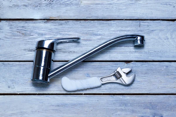 Old faucet and wrench — Stock Photo, Image