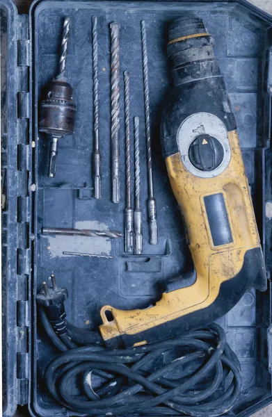 Old drill and drill bits are in the box — Stock Photo, Image