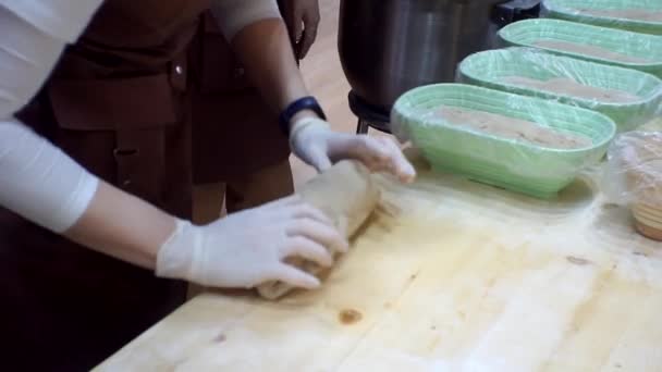 Cooking. The cook works with raw dough in the kitchen. Close-up — Stock Video