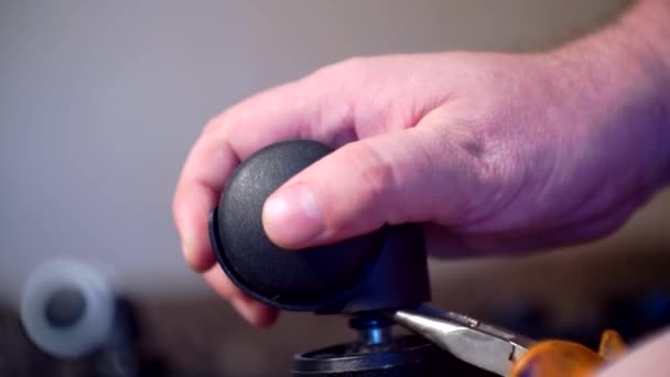 Assembly and repair of furniture.male hands replace the wheel in an office chair.close-up.shallow depth of field — Stock Video