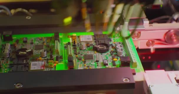 A modern industrial robot for electronics manufacturing makes a complex printed circuit board.Close-up — Stock Video