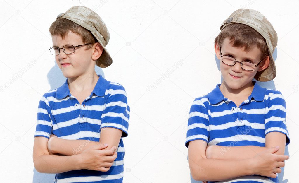little boy aged 6 to 8 years old with glasses and a cap showing a positive gesture