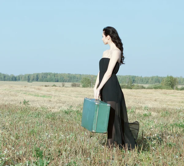 Pretty girl with a suitcase — Stock Photo, Image