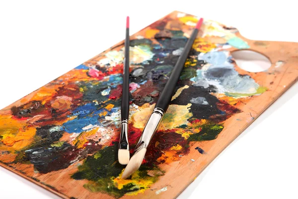 Tavolozza dei colori con pennelli — Foto Stock