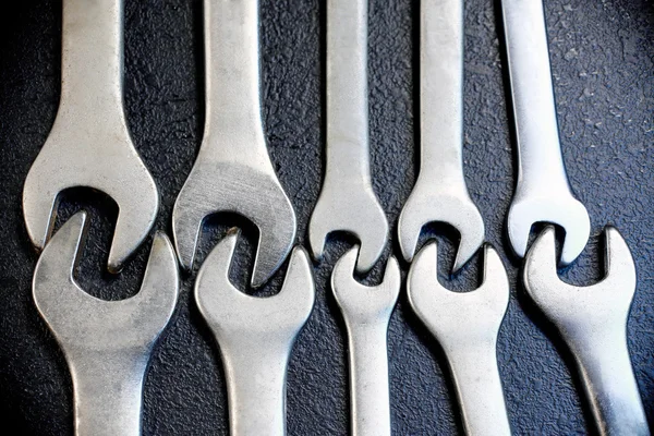 stock image Wrenches and nuts on a black background