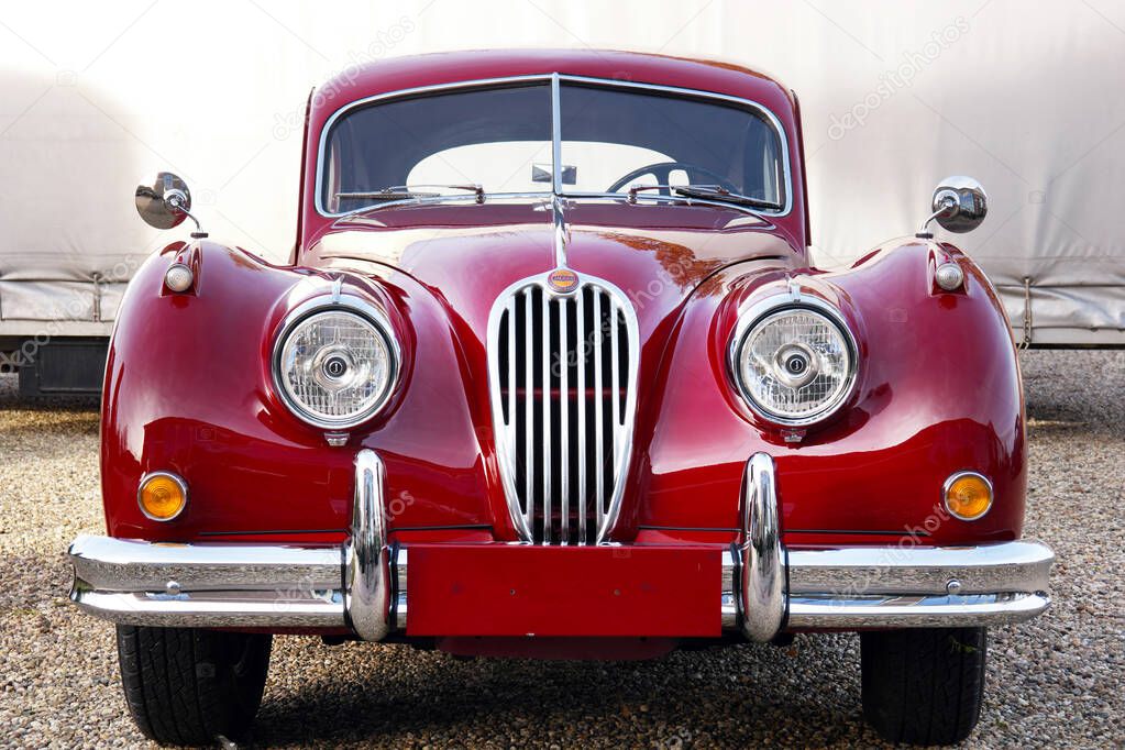 NETHERLANDS - NOVEMBER 2016: Front of a classic Jaguar XK140 FHC, Fixed head coup, a sports car manufactured by Jaguar between 1954 and 1957.