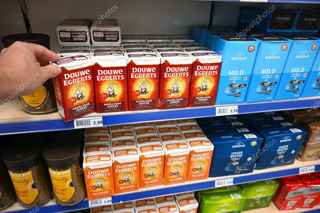 THE NETHERLANDS - AUGUST 28, 2025: Douwe Egberts brand packs of ground filter coffee in the shelves of a Die Grenze outlet supermarket.