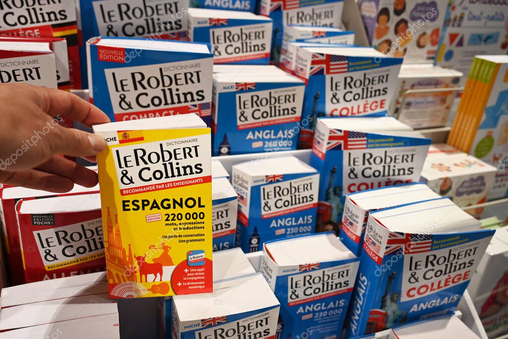 WALLONIA, BELGIUM - AUGUST 2025: The Robert & Collins Pocket espagnol-franais Dictionary for sale in the book section of a hypermarket.