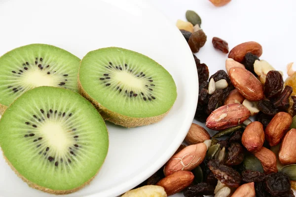 Nuts and kiwi — Stock Photo, Image