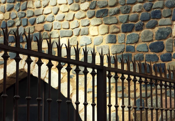 Iron fence with wall background. — Stock Photo, Image