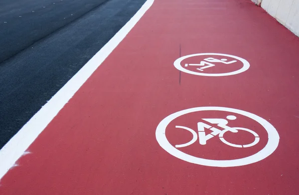Track for roller skating and cycling with a painted sign — Stock Photo, Image