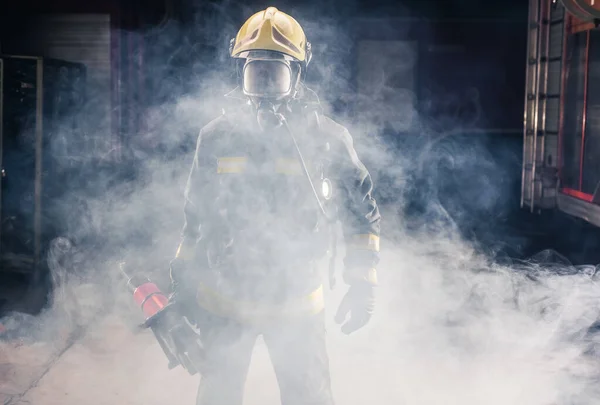 Portrait Young Fireman Standing Holding Chainsaw Middle Chainsaw Smoke — Stock Photo, Image