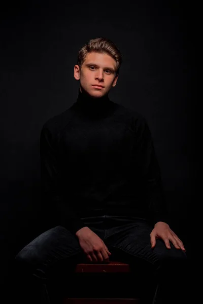 Cool Young Man Dressed Black Sweater Black Jeans Posing While — Stock Photo, Image