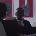 Businessmen and businesswoman having a meeting, in an office