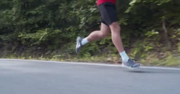 Marathon Endurance Training Man Running Alone Mountain Road Camera Side — Stock Video