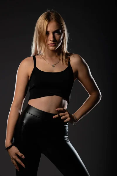 Sexy Blonde Leather Black Pants Going Crazy — Stock Photo, Image