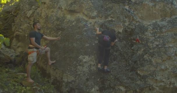 Young Girl Climbing Rock — Stock Video