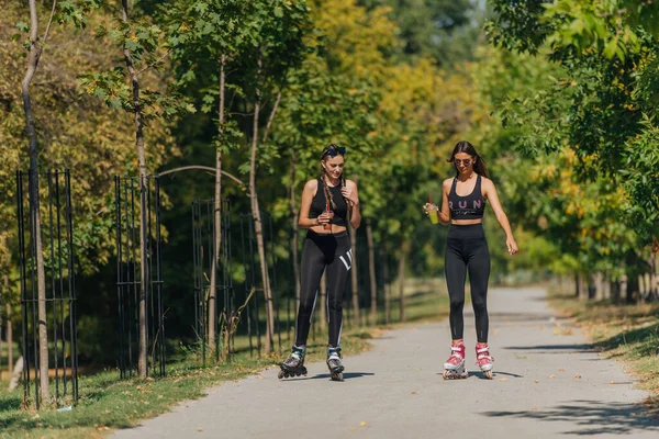 Sporty Girls Roller Skating Park Inline Skates Female Bonding — Stock Photo, Image