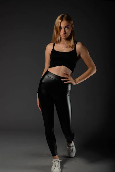 Sexy Blonde Leather Black Pants Going Crazy — Stock Photo, Image