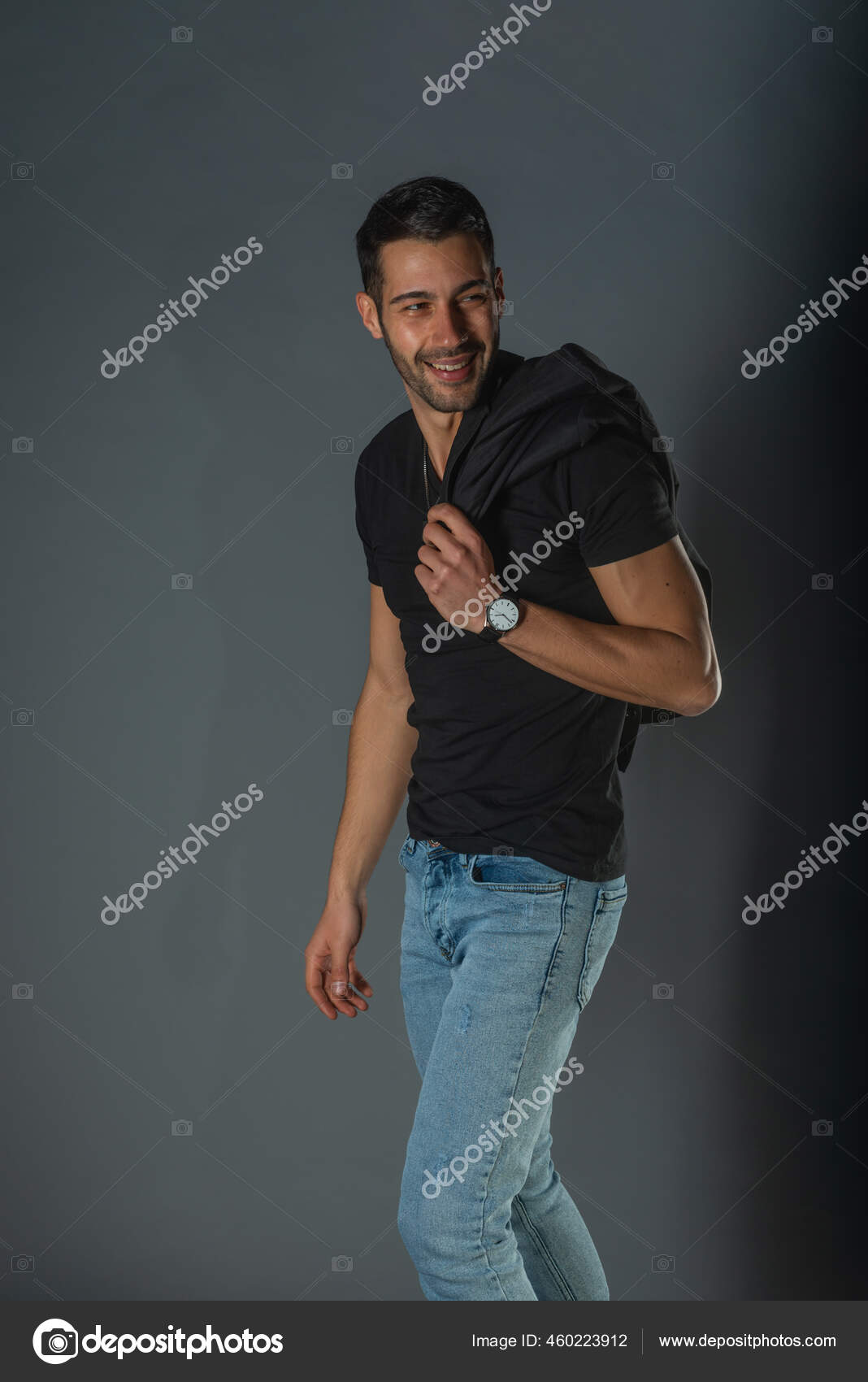 Strong Muscular Male Model Jeans Black Shirt Holding His Jacket Stock