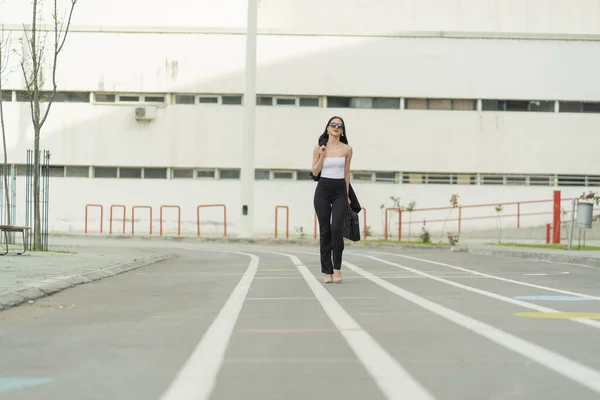 Attractive Businesswoman Walking Her Coat Laptop Bag Her Hands — 스톡 사진