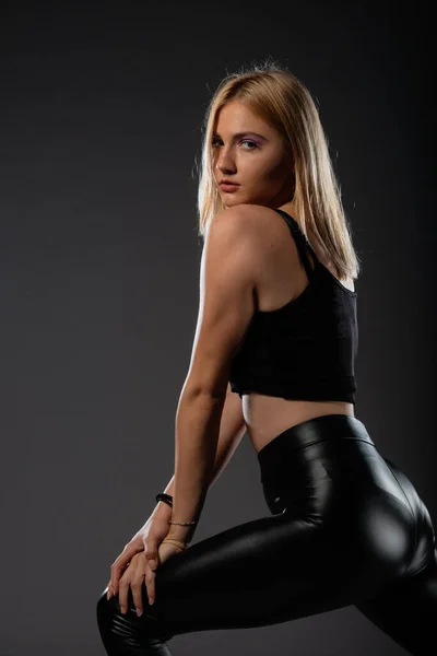 Sexy Blonde Leather Black Pants Going Crazy — Stock Photo, Image