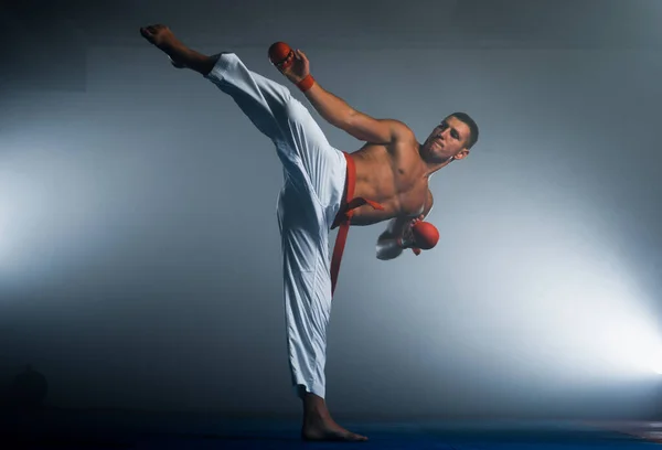 Man Kimono Red Belt Doing Forward Kick Black Background — Stock Photo, Image