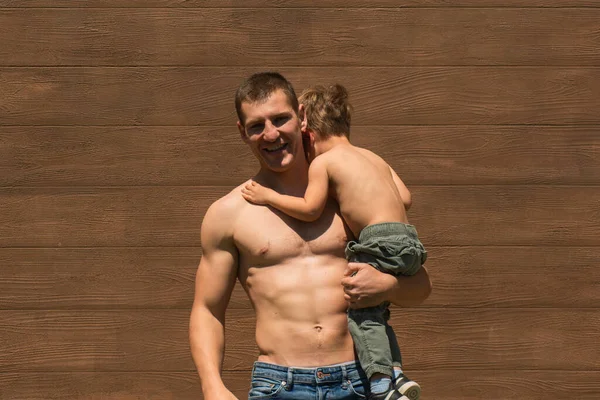 Handsome Father Posing Topless His Topless Son His Hands — Stock Photo, Image