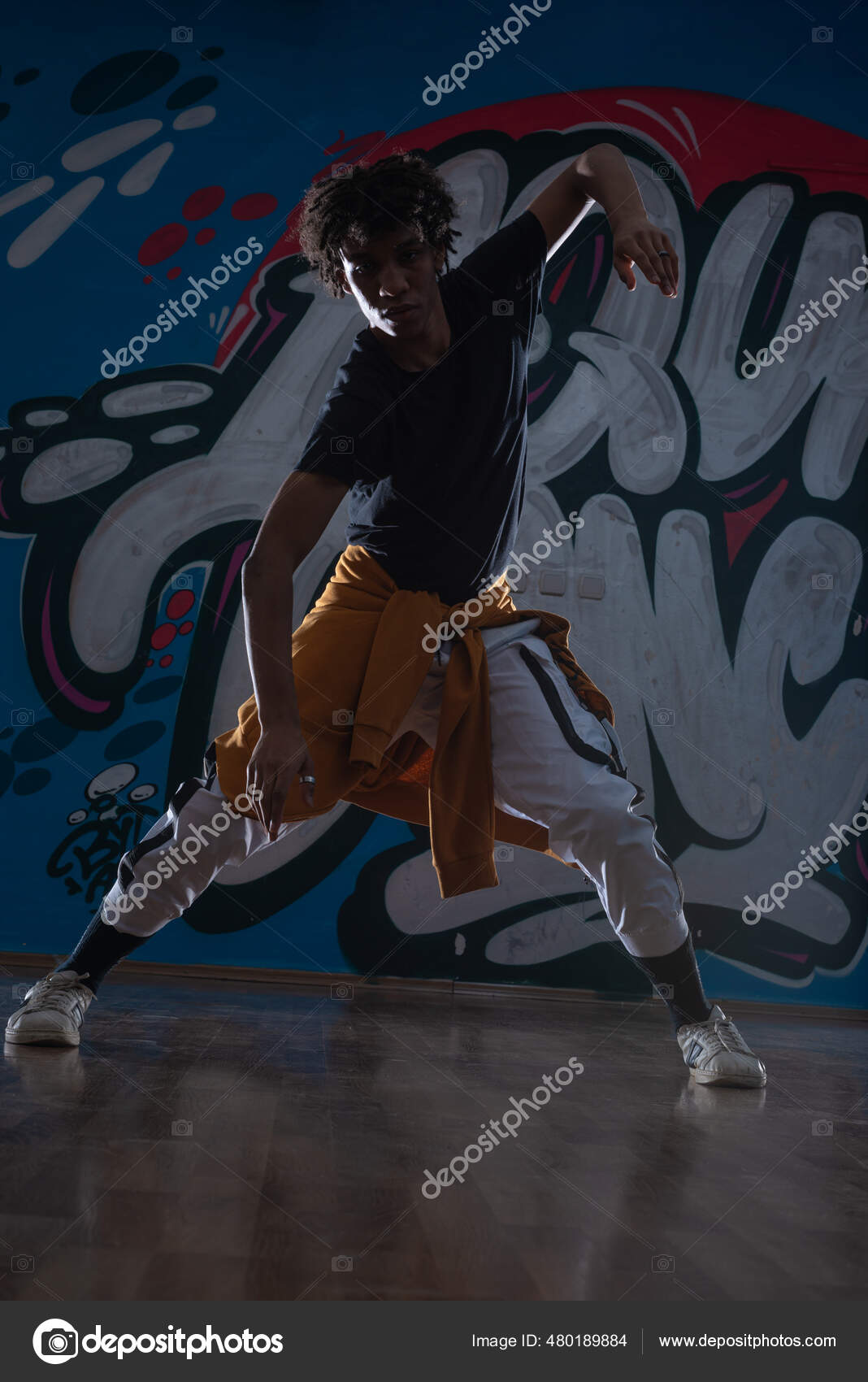 Young beautiful male dancer posing in studio Stock Photo | Adobe Stock