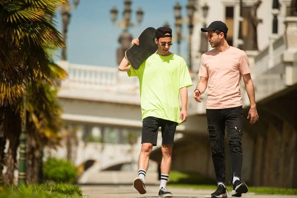 Two Fit Male Friends Walking Together While Discussing Something — Stock Photo, Image