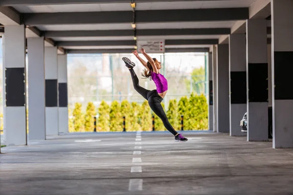 Young Woman Taking Long Jump Outdoors — Stock Photo, Image