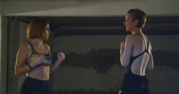 Two Girls Talking Warming Kicking Punching — Stock Video