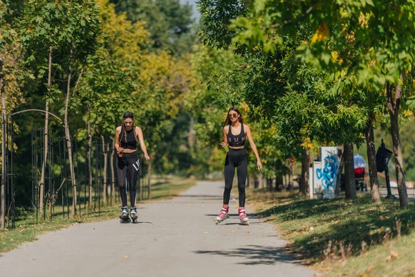 Sporty Girls Roller Skating Park Inline Skates Female Bonding — Stock Photo, Image