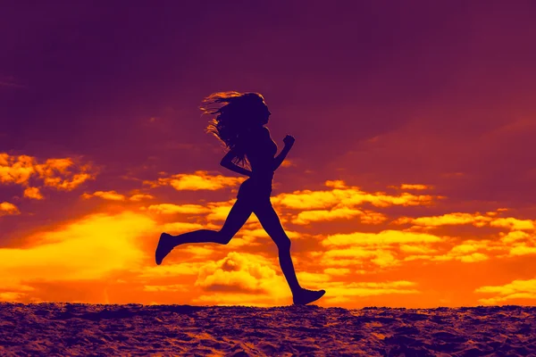 Sziluettje egy lány runner hatás filmek Stock Kép