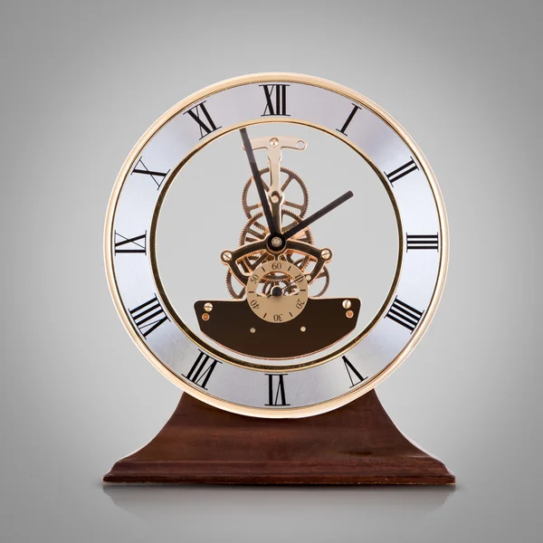Antique clock  on grey background. — Stock Photo, Image