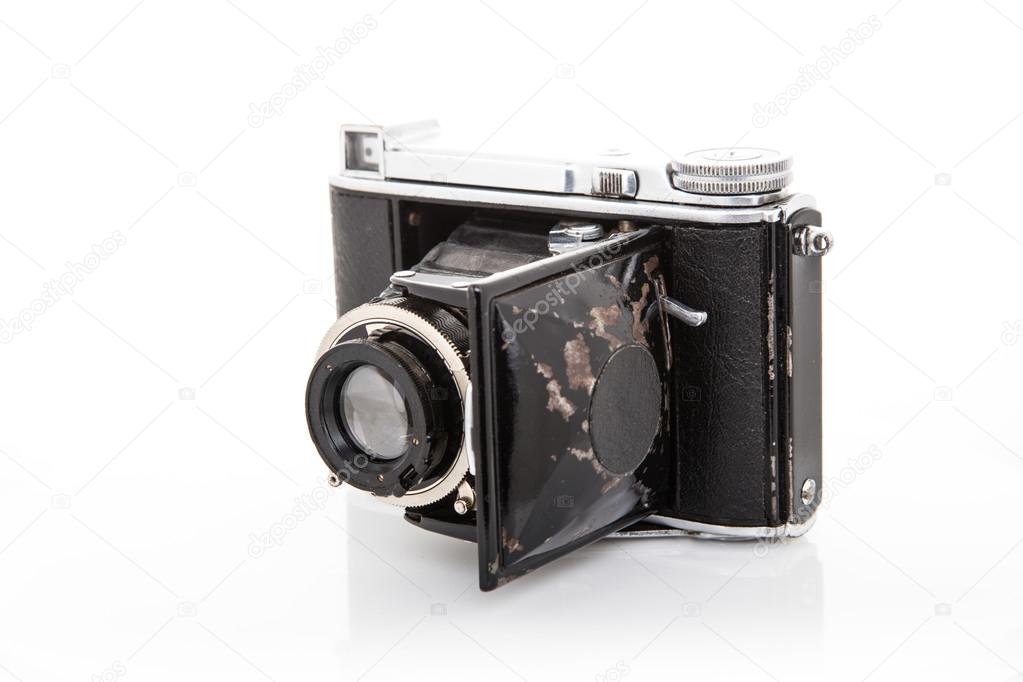 Old vintage camera on white background.