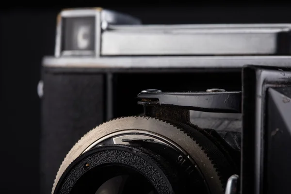 Old vintage camera on black background. — Stock Photo, Image