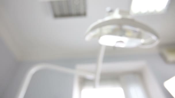 Dentist light positioned and motion. Point of view of patient in chair. — Stock Video