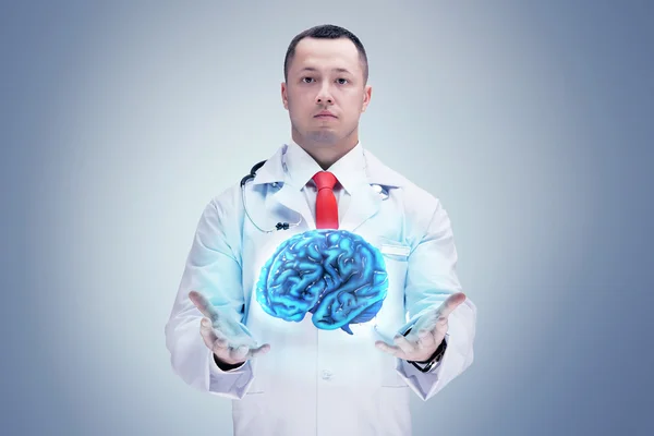 Doctor con estetoscopio y cerebro. fondo gris. Alta resolución . — Foto de Stock