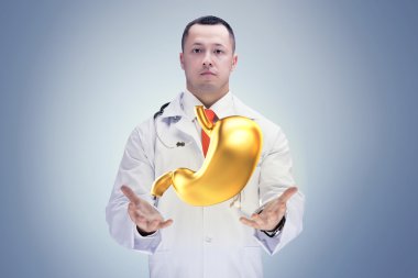 Stetoskoplu ve altın karnı hastanede ki doktor. Yüksek çözünürlük.