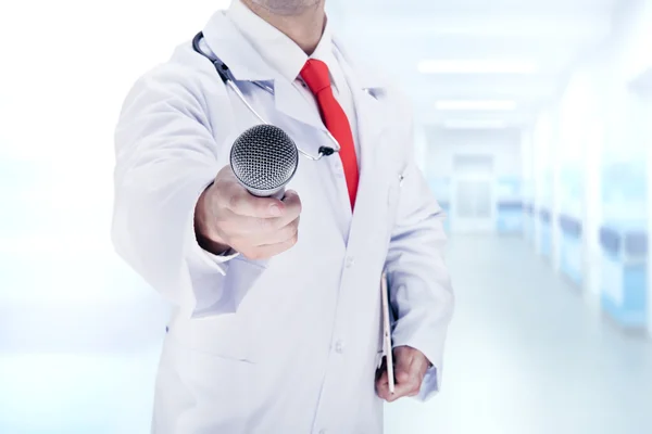 Doctor with a red tie holds mikrafon . High resolution. — Stock Photo, Image