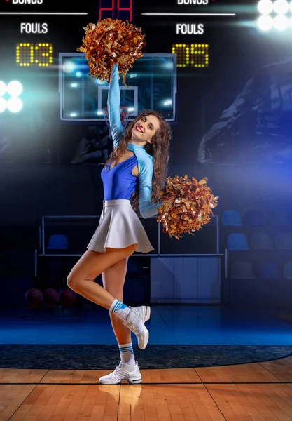 Sexy cheerleader girl posing opposite the basketball backboard with info and game score. Poster hi-end retouch — Stock Photo, Image