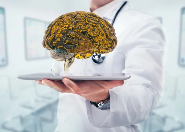 Médecin avec cerveau dans les mains dans un hôpital — Photo