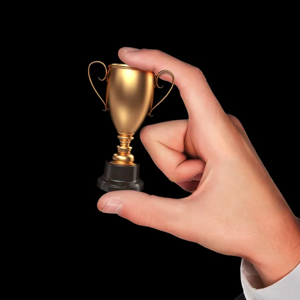 Taça do vencedor na mão . — Fotografia de Stock